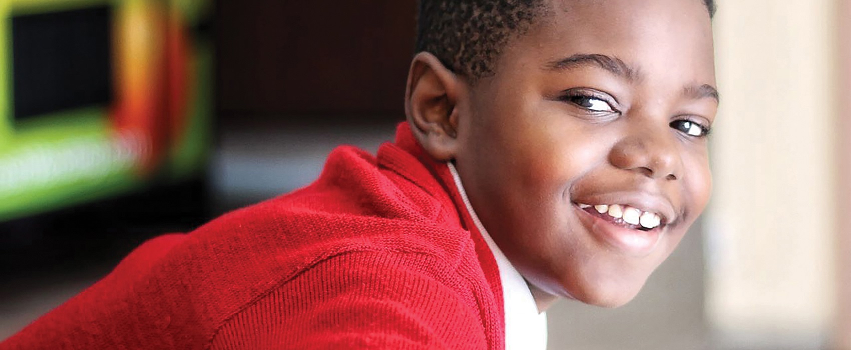 Close up of boy smiling at you