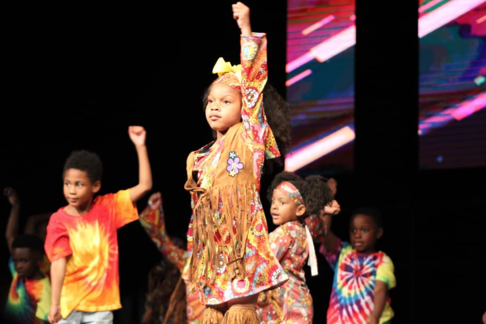 Imani students performing on stage