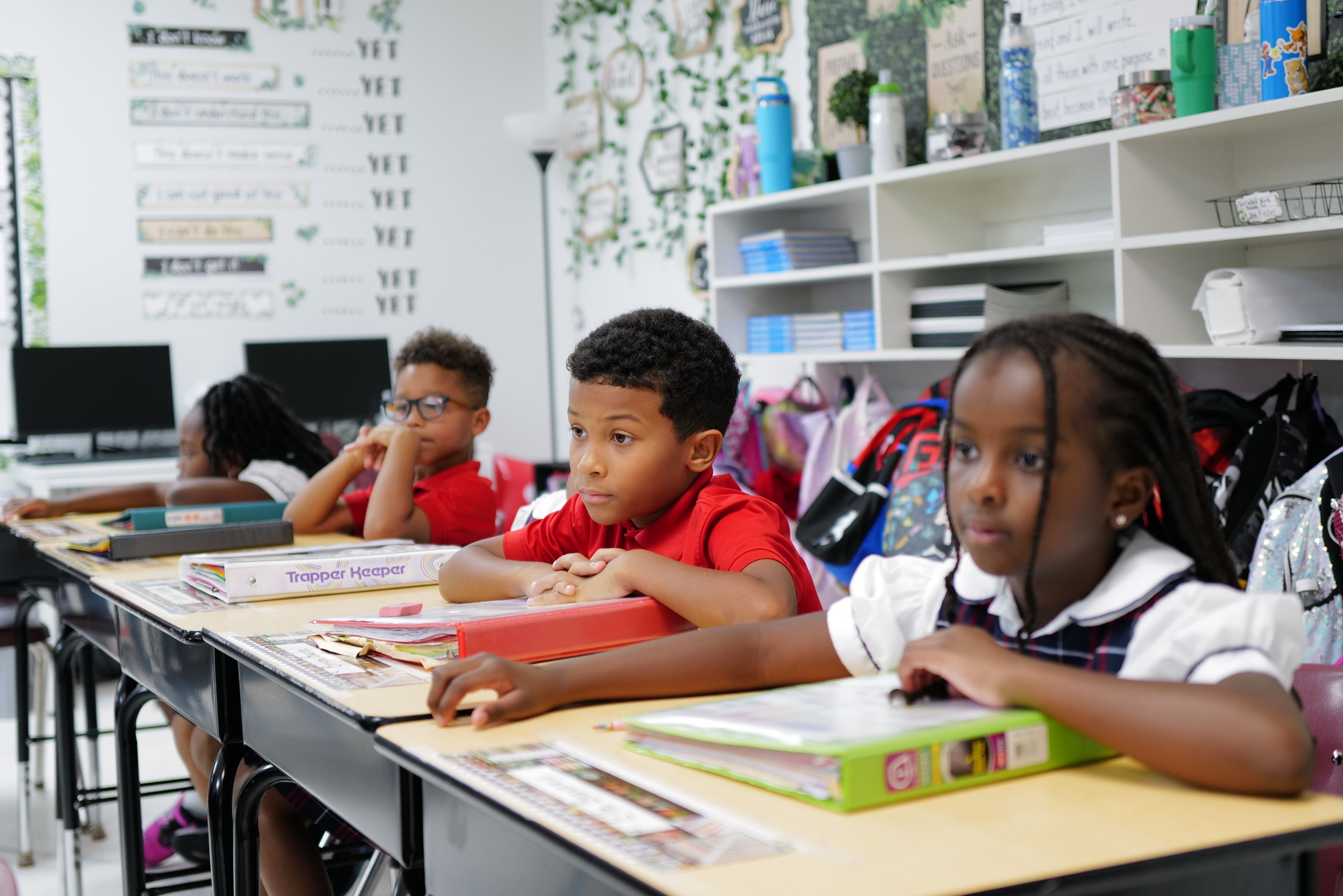 Students engaged in collaborative learning at The Imani School